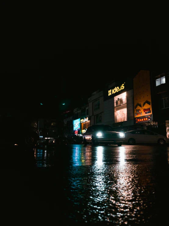 a city street at night with dark lights on it