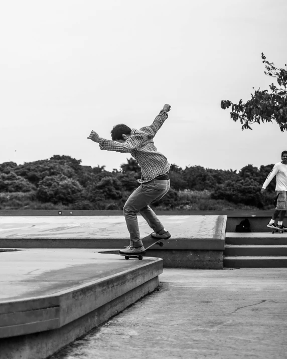 the boy is trying to do a trick on his skateboard