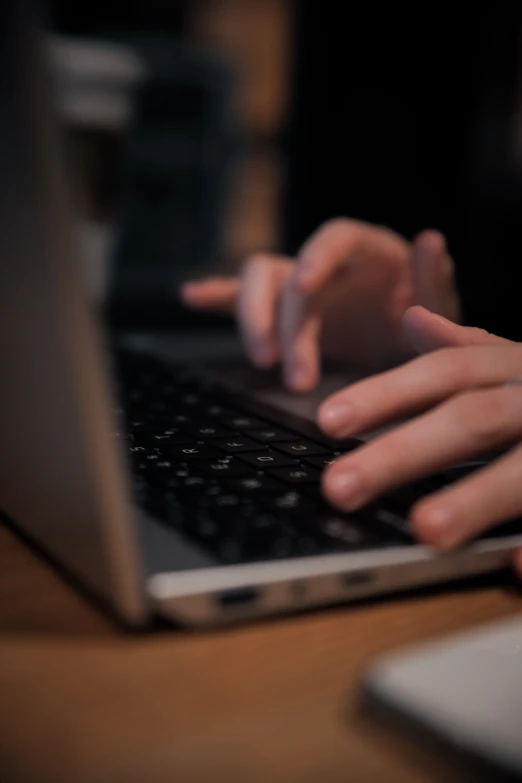 someone using a lap top on their desk