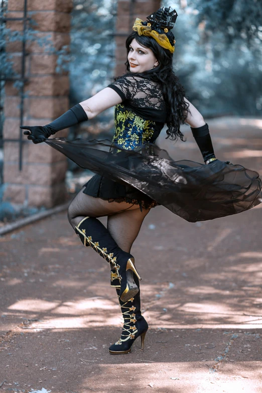 a woman in a black and yellow costume with high heels on a street