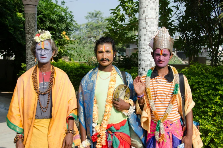 some people standing near each other dressed in costumes