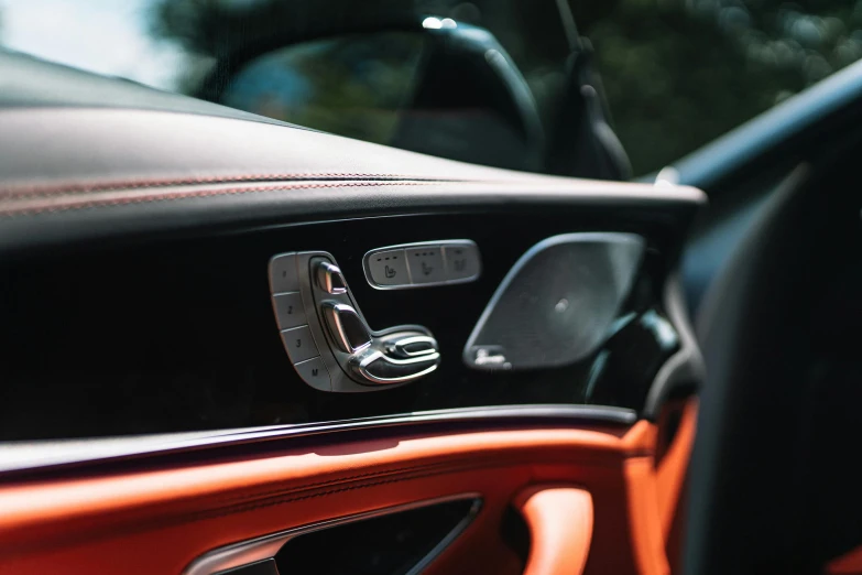 the dashboard of a car that has its door handle missing