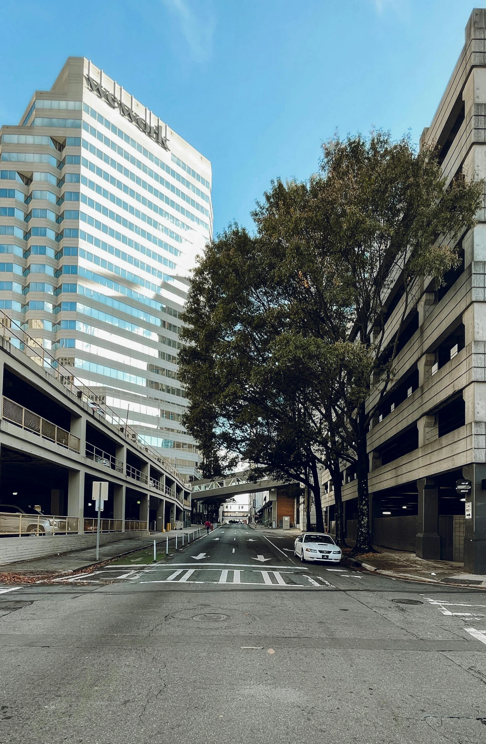 an empty street in the city between two buildings