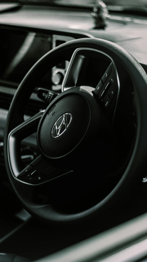 the inside view of a car and steering wheel