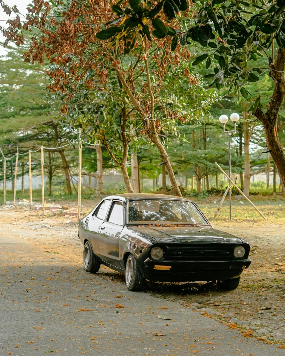 a car is parked in front of an empty playground