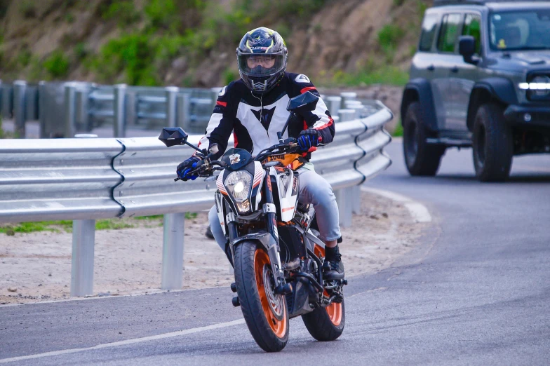 a man on a motorcycle races down the street