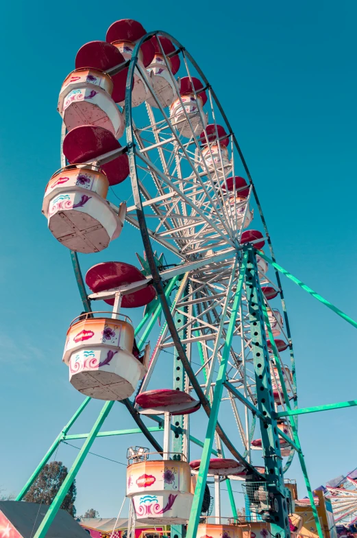 the carnival rides at an amut park and have many cups