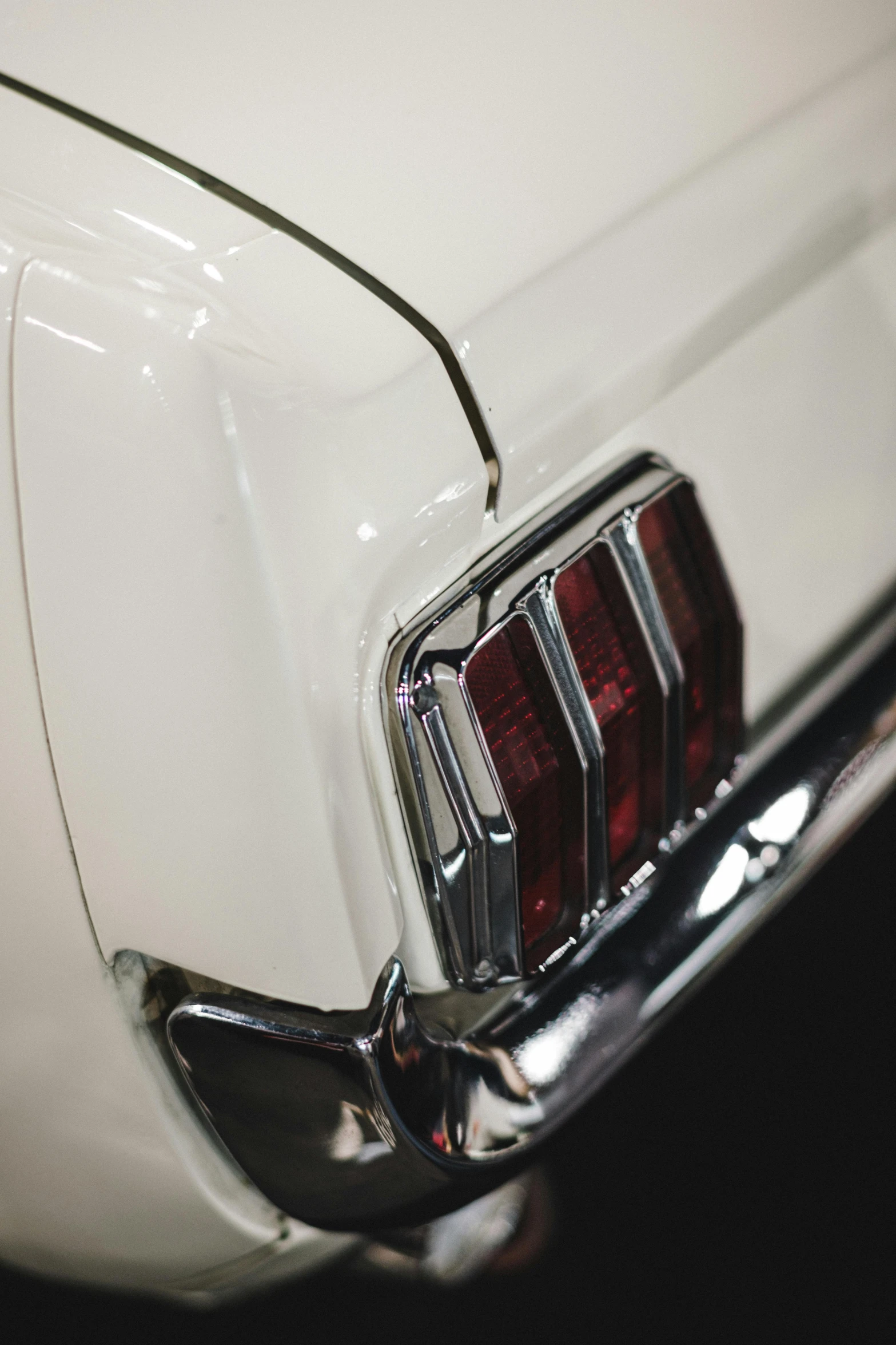 a classic car badge with a red line is shown