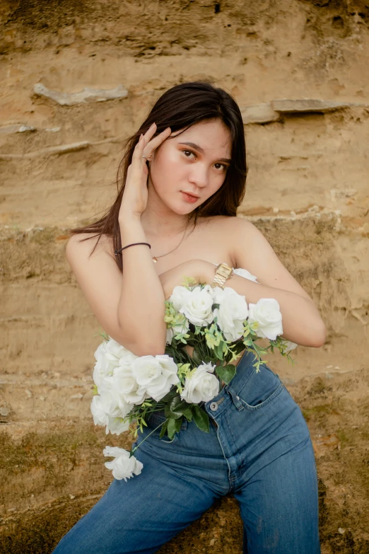 the young woman is posing with her hands on her hips