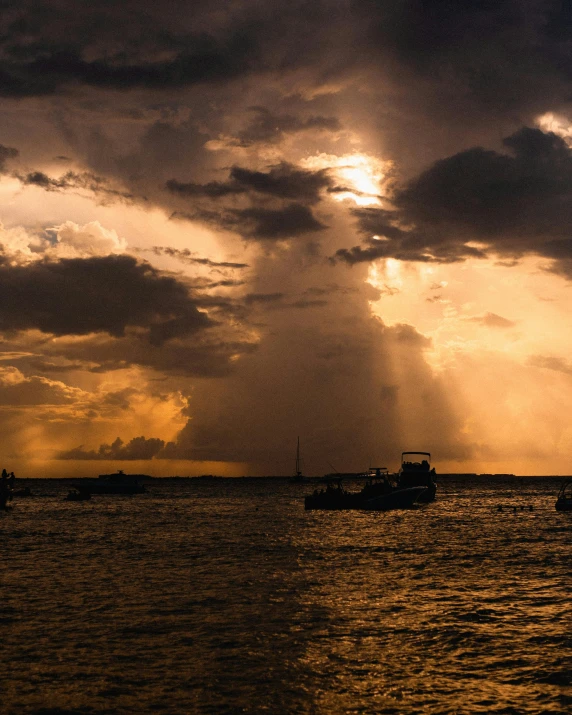 a group of boats floating across a large body of water