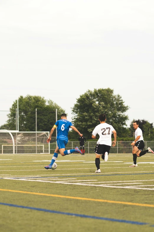 a group of young men playing a game of soccer