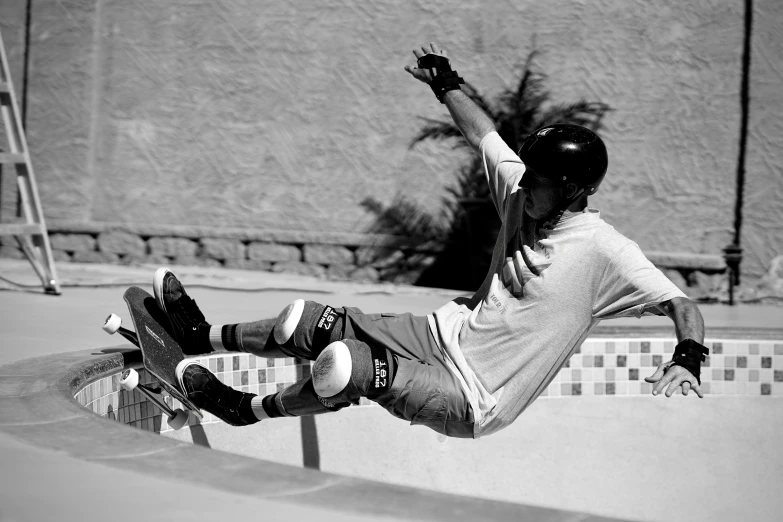 a boy is doing a skateboard trick outside