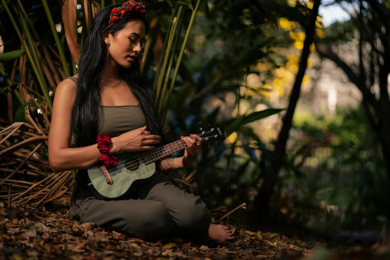 a woman with dread locks holding an acoustic guitar