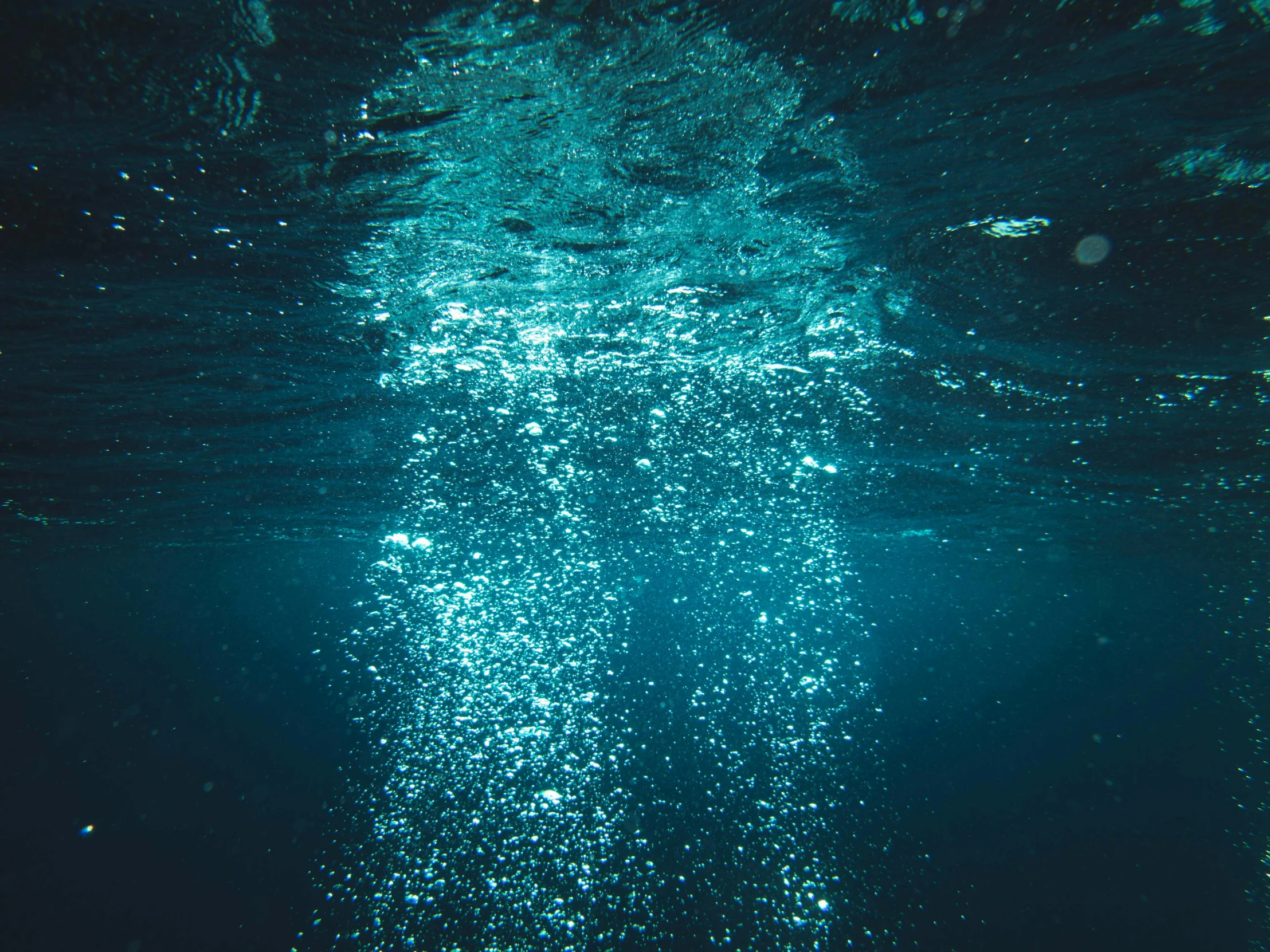 some water bubbles on the blue water