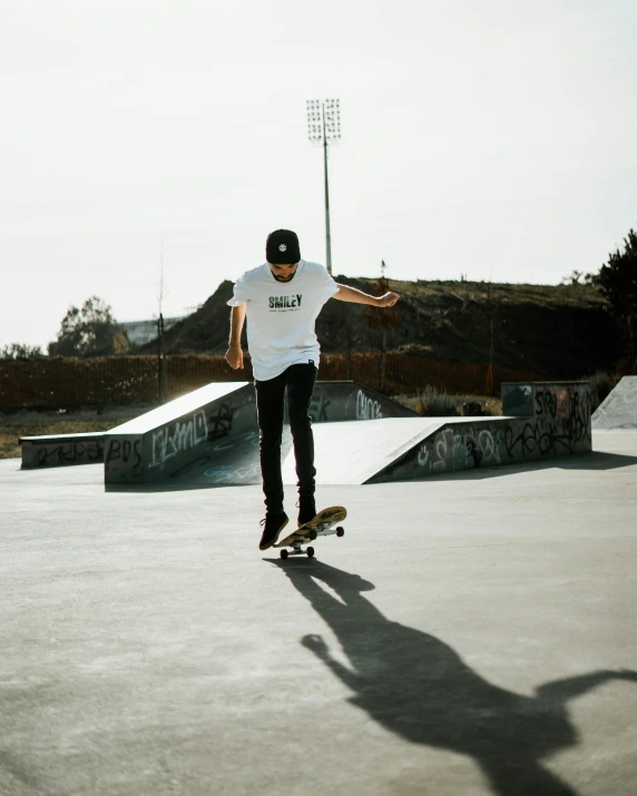 the boy is riding his skateboard at the skate park