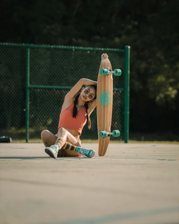 the young woman is practicing her tricks on her skateboard