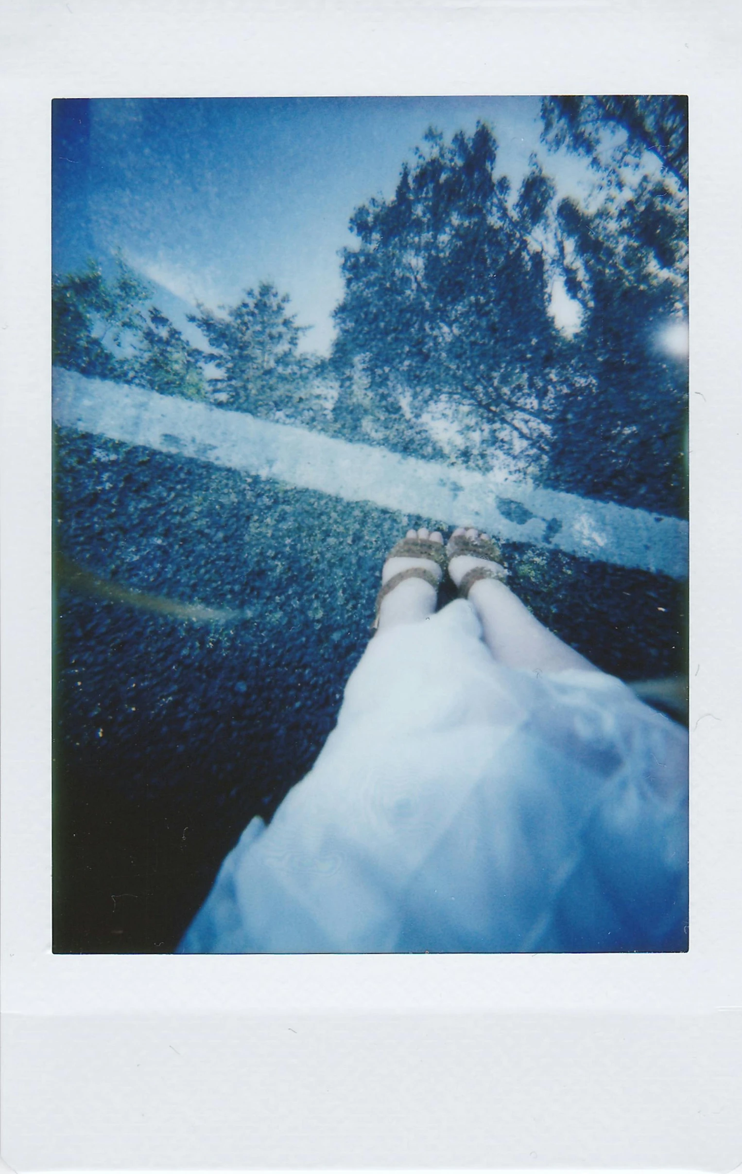 the feet of a person in shoes on snow and ice