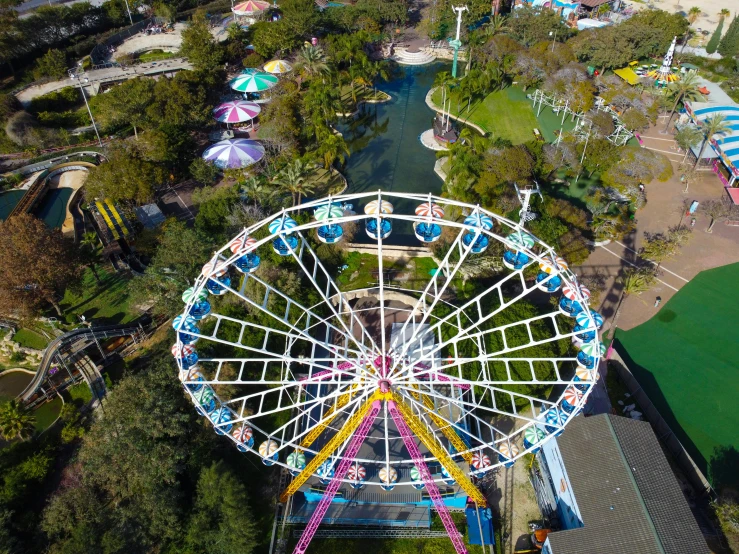 an amut park ride sits next to some other rides