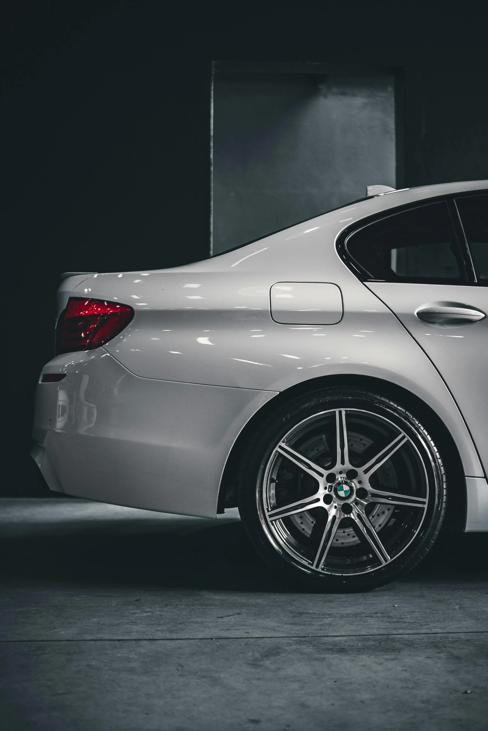 a silver car is parked in the garage