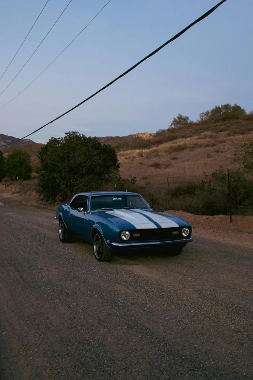 the car is traveling down the empty street