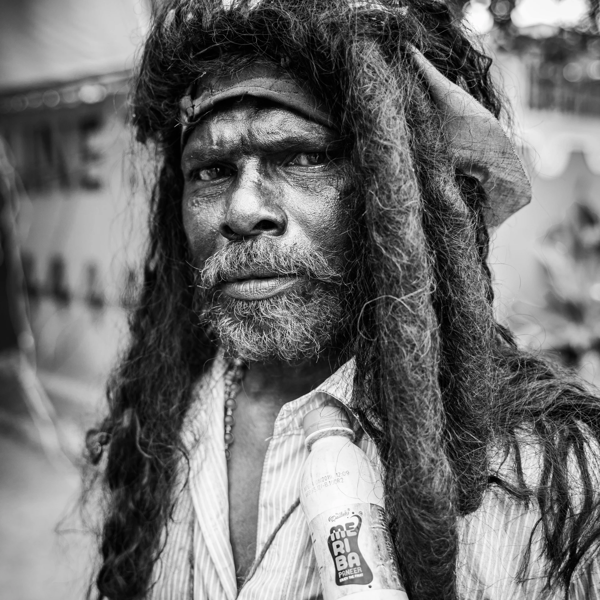 a black and white po of someone with their head covered in dust