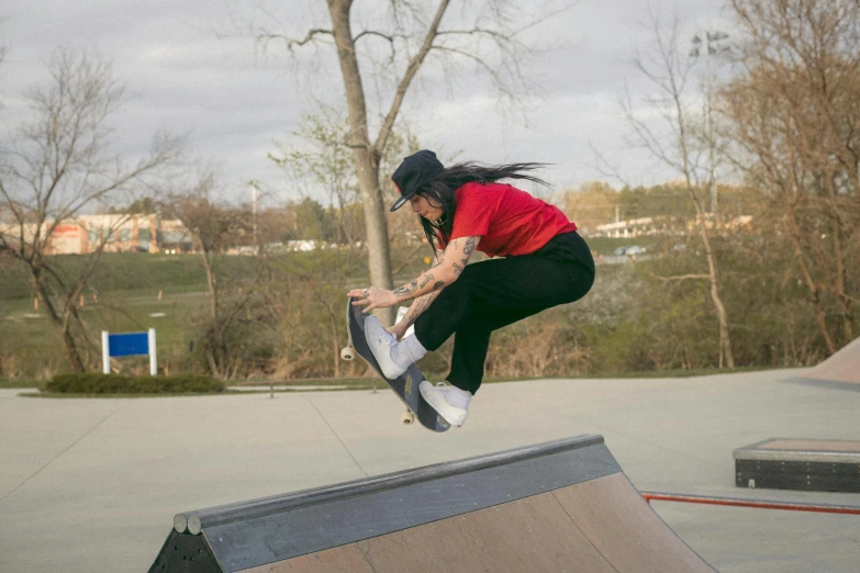 a man flying through the air while riding a skateboard