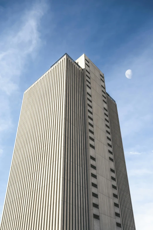 a building is shown against a blue sky