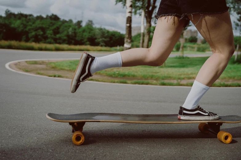 a man with knee ces riding on top of a skateboard