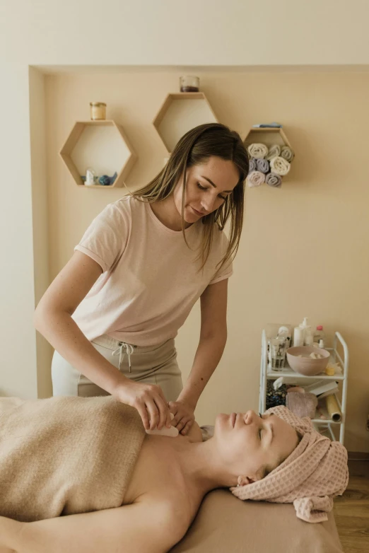 woman receiving facial massage in a spa