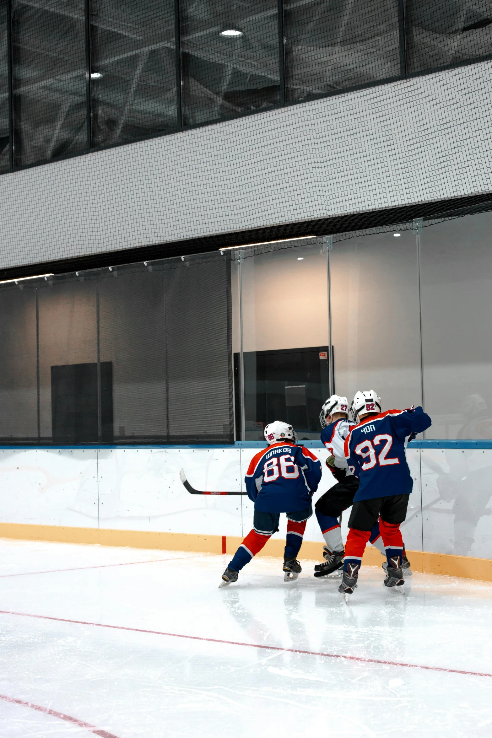 two teams of boys hockey playing against each other