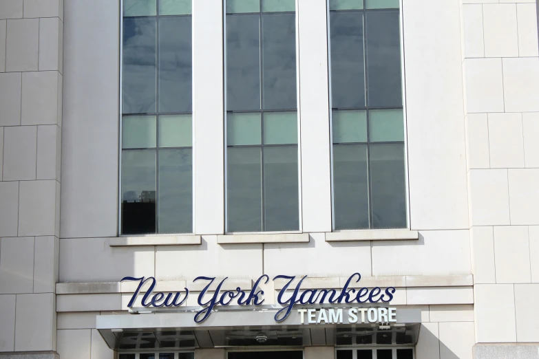 the front entrance of a large white building