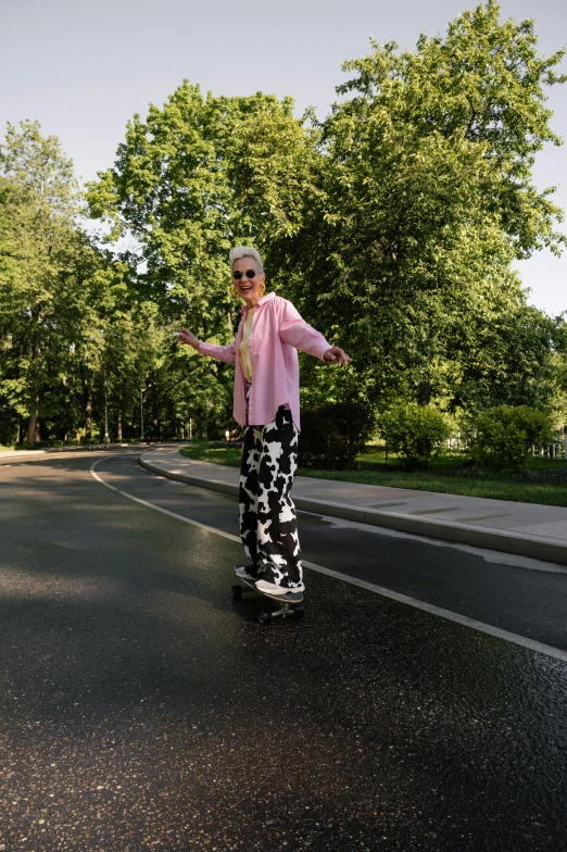 a man is skate boarding on the street