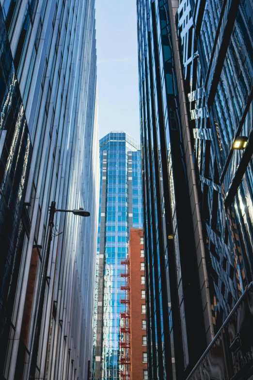 a number of buildings in a city with tall glass windows