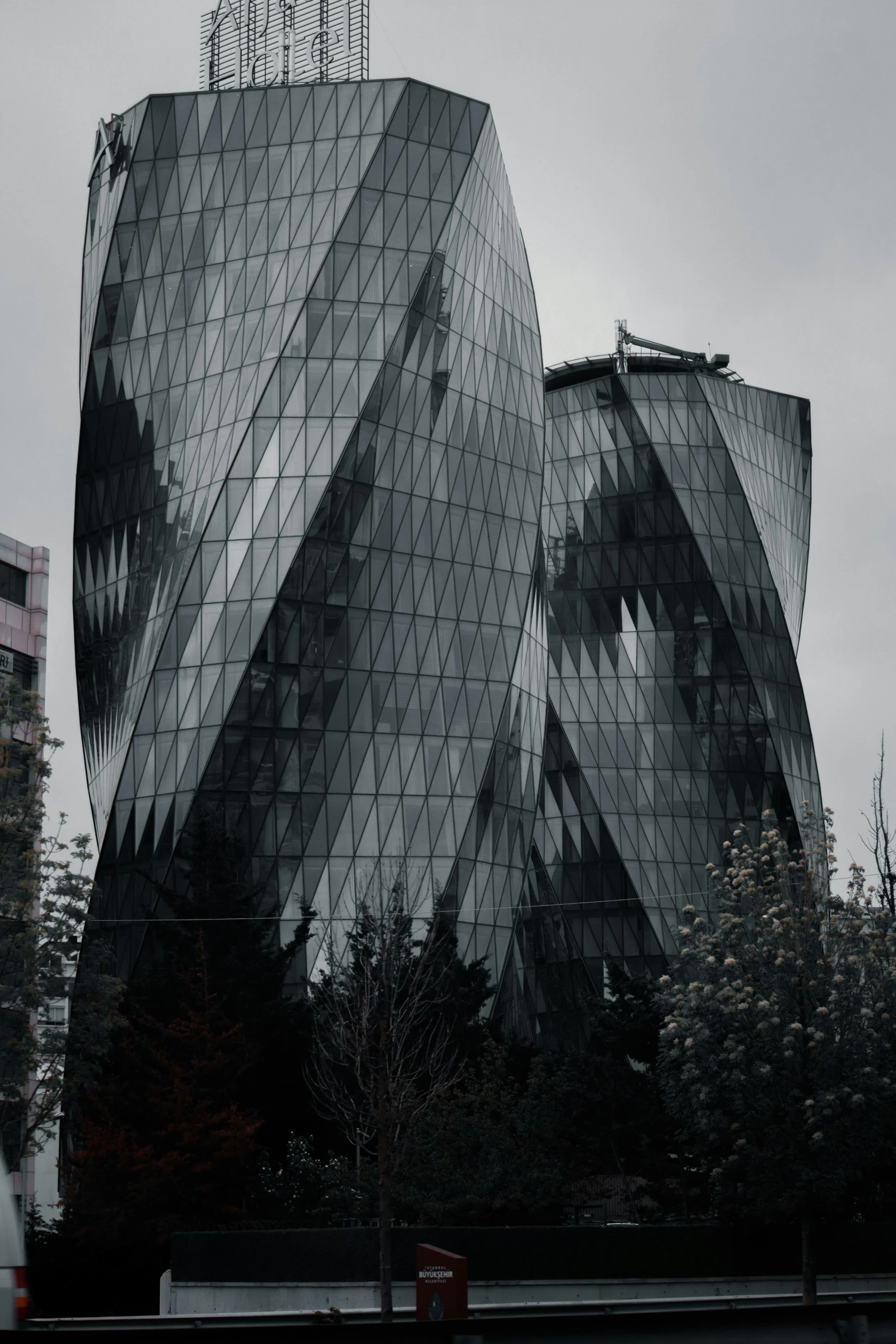 the large curved building has glass windows on its side