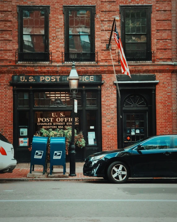 a man is standing on a curb by the street