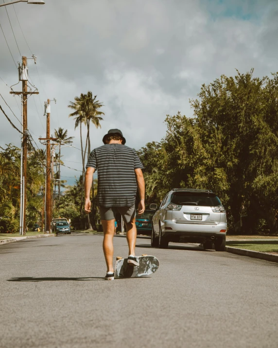 a man riding a skateboard down a street