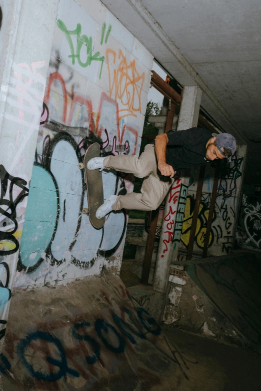 a young person jumping into the air on a skateboard