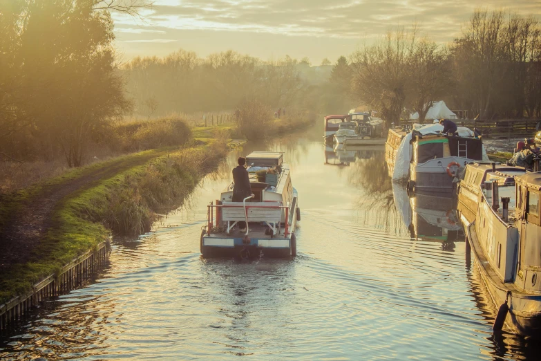 a view of some boats traveling through the water