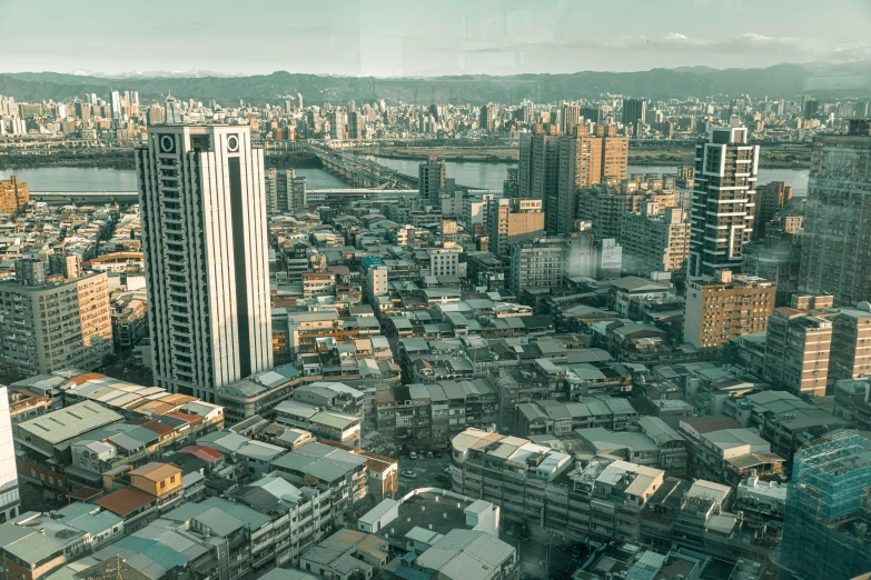 a city with tall buildings next to a river