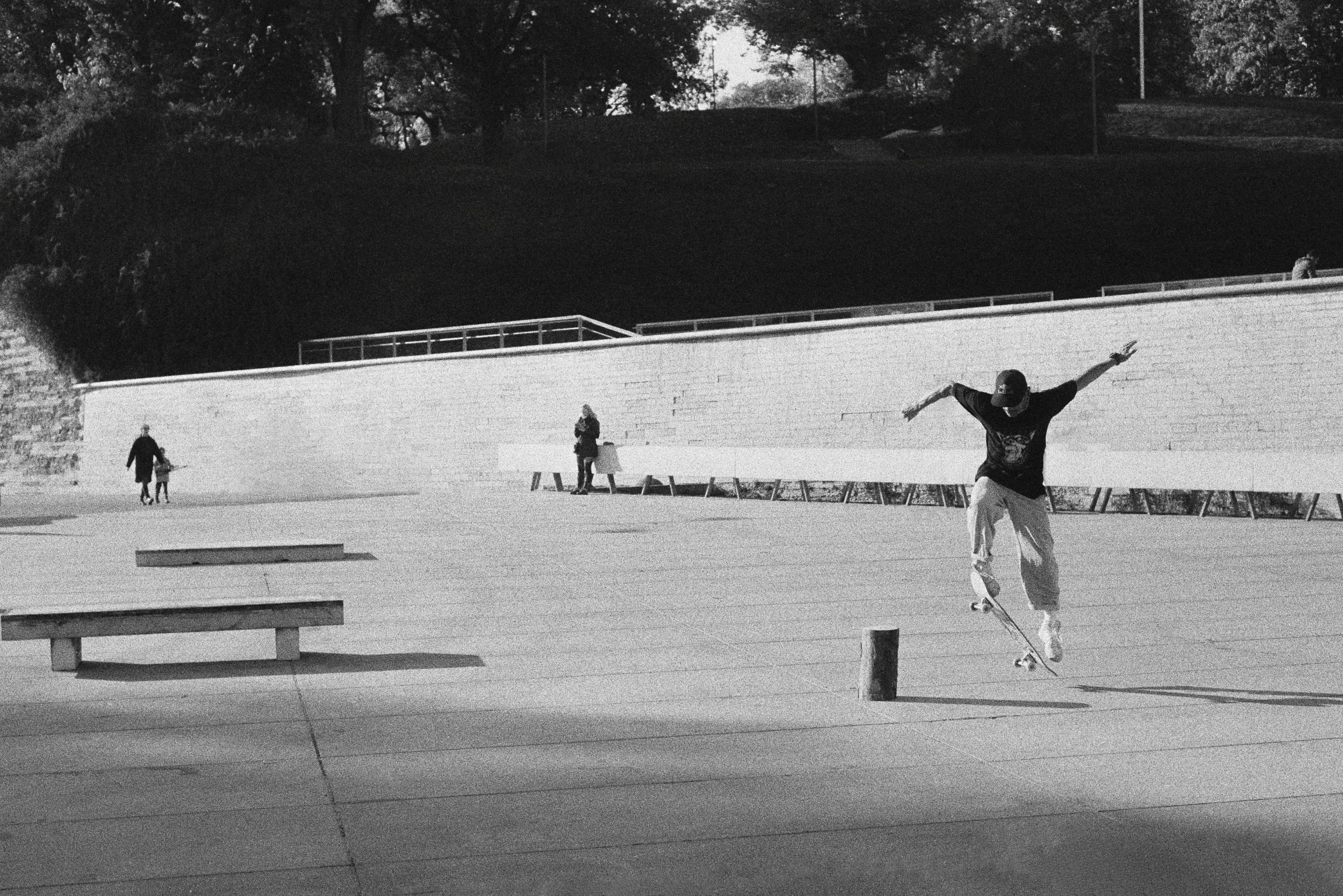 the man is standing in front of the wall with his arms out