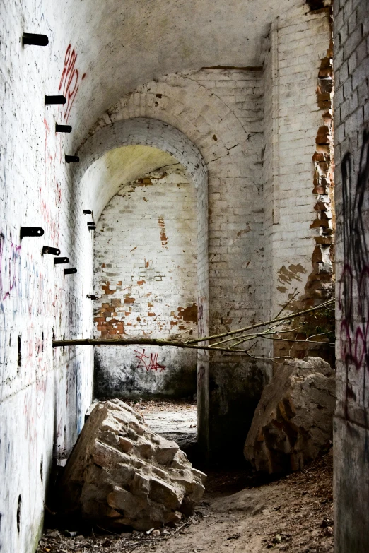 a very old alley with graffiti all around