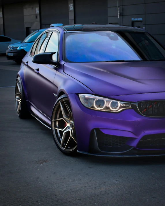 a purple car parked in a parking lot