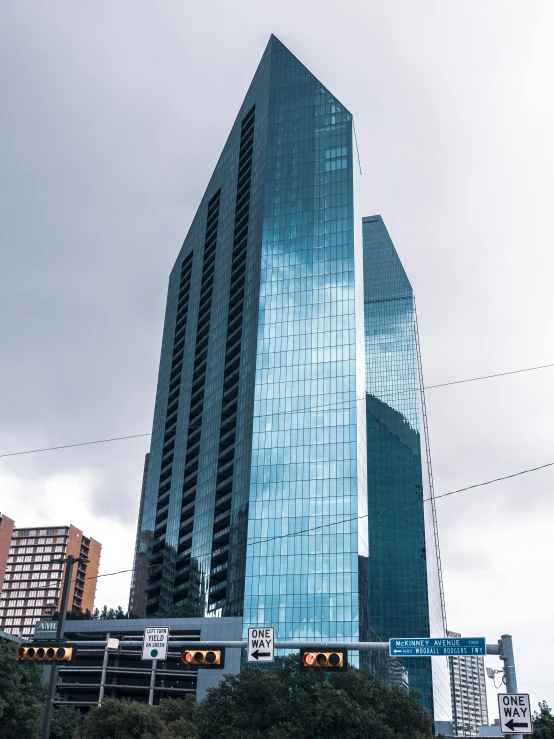 modern skyscr on a cloudy day, with a tram coming up the hill