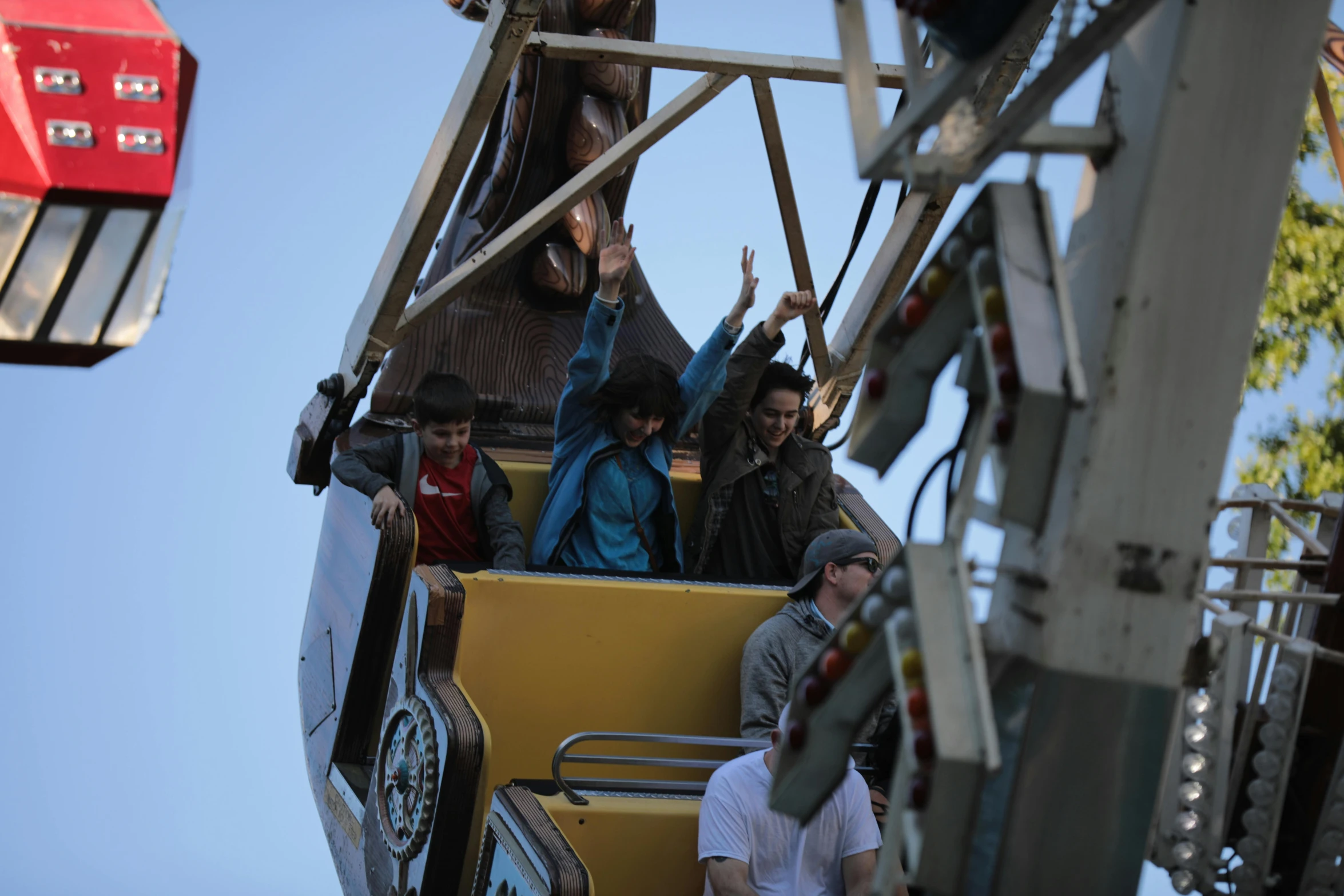 several people riding on a ride in a roller coaster