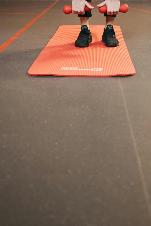 a person performing stretching exercises on an exercise mat