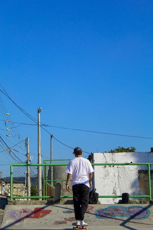 a man riding a skateboard on a sidewalk