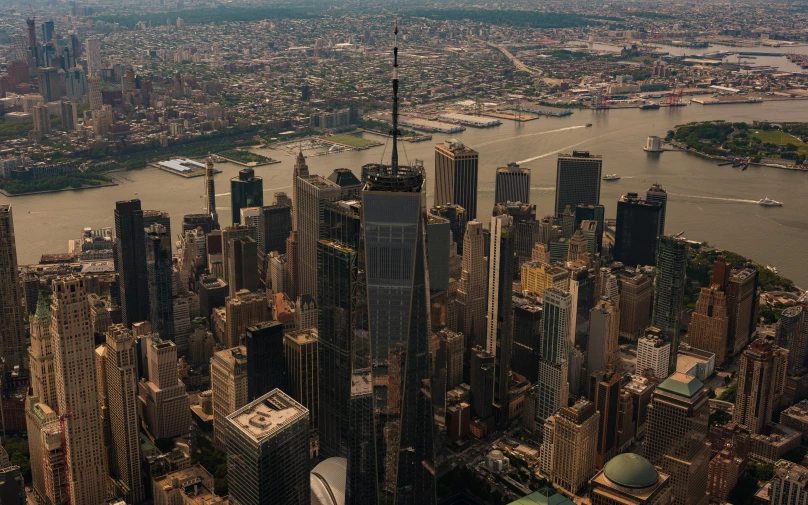 a large cityscape next to a river is shown