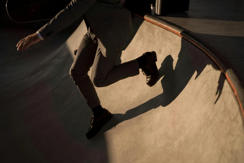 skateboarder grinding a rail on his board in the dark