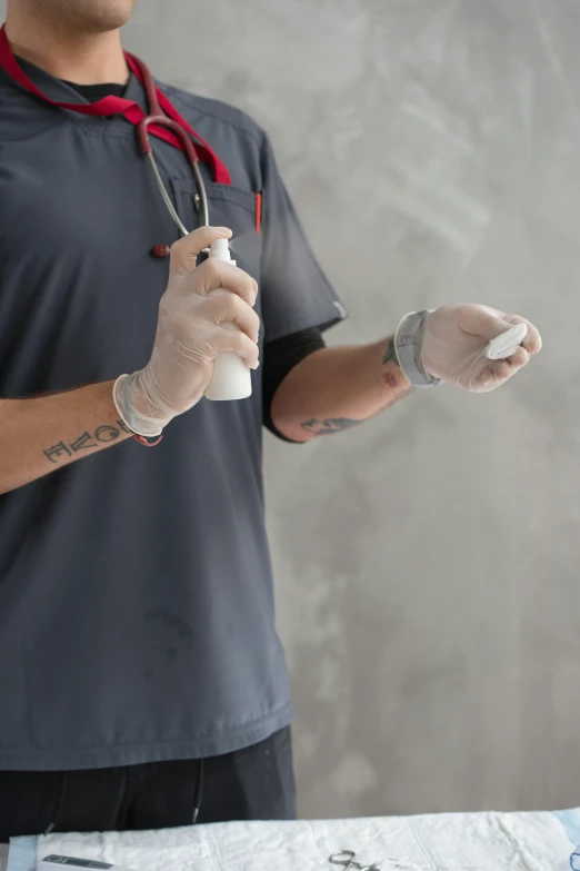 a man that has his arm wrapped in a medical glove