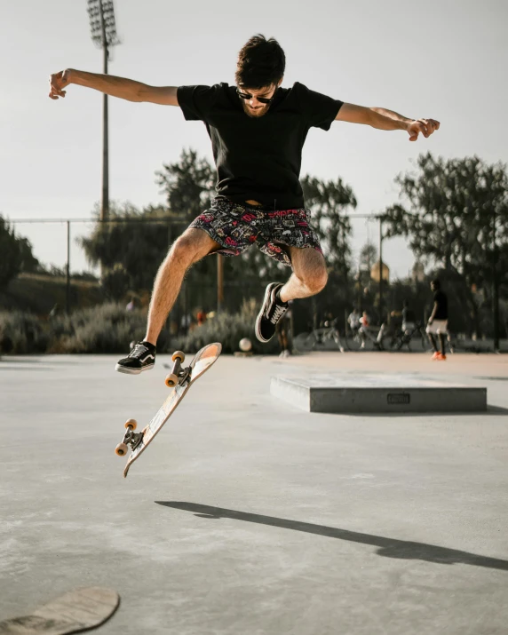 skateboarder performing aerial stunt at outdoor public park